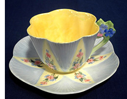 Blue and yellow floral handled Dainty cup and sauce